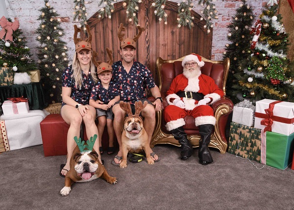 Santa Pet Photo 2023 family with dogs and santa